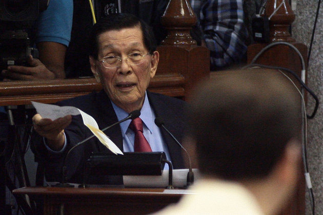 Senate President Juan Ponce Enrile answers the queries of Senator Allan Peter Cayetano during a session at the Senate, Jan. 23, 2013. (Voltaire Domingo, NPPA Images)