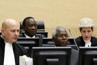Kenyan Deputy Prime Minister and Finance Minister Uhuru Kenyatta (second-left), and Cabinet secretary Francis Muthaura (second-right) attend a hearing, at the International Criminal Court in The Hague, on August 8, 2011