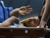 Manchester City's Aguero waves to supporters as he is stretchered off the pitch during their English Premier League soccer match against Southampton in Manchester