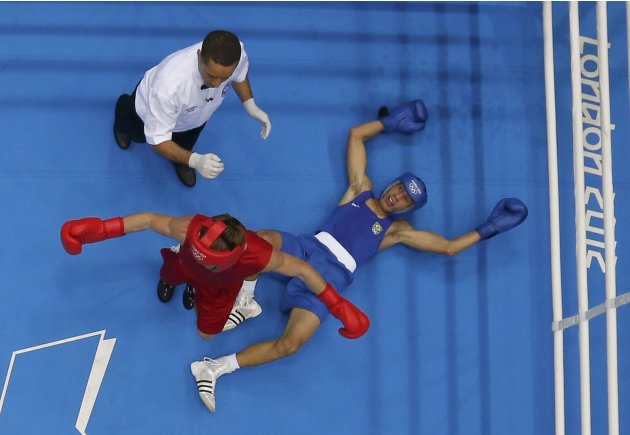 Russia's Vodopiyanov fights against Brazil's Vierira de Jesus in their Men's Bantam (56kg) Round of 16 boxing match during the London 2012 Olympic Games