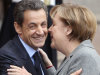 FILE - In this Nov. 24, 2011 file photo, German Chancellor Angela Merkel and French President Nicolas Sarkozy say goodbye after their meeting in Strasbourg, France. Sarkozy and Merkel are scheduled to meet in Paris on Monday, Dec. 5, 2011, to unveil a proposal for closer political and economic ties between the 17 countries that use the euro. While the leaders differ on some of the details, their cooperation has been so tight they have come to be known by a single name: "Merkozy." (AP Photo/Michael Probst, File)