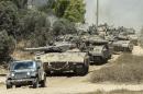 Israeli Merkava tanks roll to the southern Israeli border with the Gaza Strip, on August 1, 2014