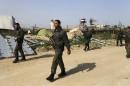 Members of Palestinian security forces loyal to Hamas patrol on border between Egypt and southern Gaza Strip