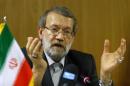 Larijani Speaker of the Iranian Parliament, gestures during a news conference in Geneva