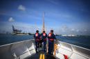 United States Coast Guard personnel are seen on their boat as they arrive back in Miami Beach on October 17, 2012