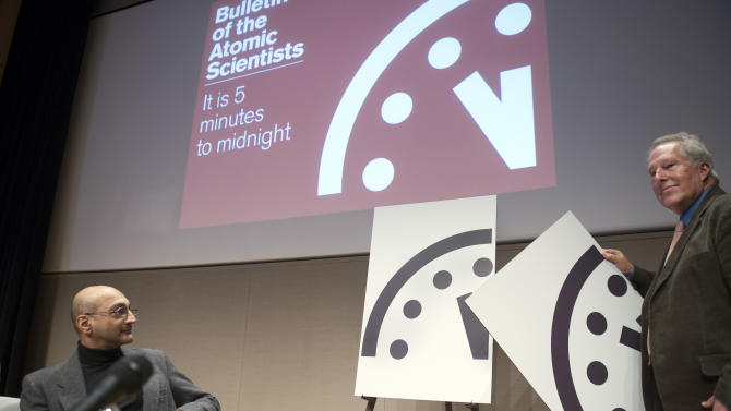 FILE- In this Jan. 22, 2015, file photo, Climate scientist Richard Somerville, member, Science and Security Board, Bulletin of the Atomic Scientists, right, unveils the new &quot;Doomsday Clock,&quot; accompanied by Sivan Kartha, member, Science and Security Board, Bulletin of the Atomic Scientists and senior scientists at the Stockholm Environmental Institute, right. Scientists behind a &quot;Doomsday Clock&quot; that measures the likelihood of a global cataclysm are set to announce Tuesday Jan. 26, 2016, whether civilization is any closer or farther from disaster. (AP Photo/Cliff Owen, File)