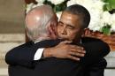 President Barack Obama hugs Vice President Joe Biden during funeral services for Biden's son, Beau Biden, Saturday, June 6, 2015, at St. Anthony of Padua Church in Wilmington, Del. Obama delivered the eulogy for Vice President Joe Biden's son, Beau, who lost his battle with brain cancer at age 46. (Yuri Gripas/Pool Photo via AP)