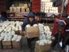 A Chinese man carries a box of cauliflowers at a farm produce wholesale market in Fuyang in central China's Anhui province Friday Jan. 11, 2013. China's inflation spiked to a six-month high in December after a freezing winter pushed up vegetable prices, possibly complicating efforts to sustain a shaky economic recovery, the National Bureau of Statistics reported Friday. (AP Photo) CHINA OUT