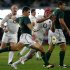 South Africa's Steyn gets his kick past England's Botha during their first rugby test match in Durban