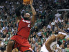 Miami Heat forward LeBron James (6) shoots over Boston Celtics guard Rajon Rondo, right, during the first half in Game 6 of the NBA basketball Eastern Conference finals, Thursday, June 7, 2012, in Boston. (AP Photo/The Miami Herald, Charles Trainor Jr.)  MAGS OUT