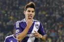 Anderlecht's Aleksandar Mitrovic celebrates scoring 1-1 during the Group D Champions League soccer match between Dortmund and Anderlecht in Dortmund, Germany, Tuesday Dec. 9, 2014. (AP Photo/Frank Augstein)