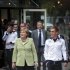 German Chancellor Merkel and the captain of the German national soccer team Lahm walk to attend a dinner in the team's Euro 2012 headquarters in Sopot