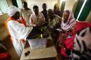 Sudanese election staff seal a ballot box at a polling station in North Darfur's state capital El Fasher, as the polls close on April 13, 2016