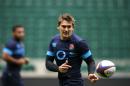 England's rugby player Toby Flood (C) passes the ball during the captain's run at Twickenham Stadium, southwest of London, on November 1, 2013