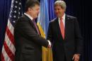 U.S. Secretary of State John Kerry, right, meets with Ukraine president-elect Petro Poroshenkois in Warsaw, Poland, Wednesday, June 4, 2014. (AP Photo/Charles Dharapak)