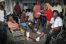 Some of those who sustained injuries from an explosion at a bar in the Mishomoroni district of Mombasa, which police at the scene said was a grenade attack, are treated at the Coast General Hospital in Mombasa, Kenya late Sunday, June 24, 2012. The explosion comes after the U.S. Embassy in Kenya on Friday warned of an imminent threat of a terrorist attack in Mombasa and said all U.S. government personnel had to leave the city. (AP Photo)