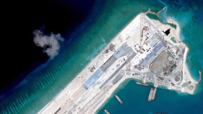 This satellite image by DigitalGlobe and released by the Center for Strategic and International Studies (CSSI) shows what is claimed to be an airstrip at Fiery Cross Reef in the Spratly Islands in the disputed South China Sea