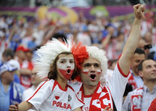 Polish fans cheer before the start of their Group A Euro 2012 soccer match against Greece in Warsaw