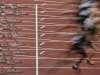 Runners start during a men's 100m heat at the BUCS Outdoor Athletics Championships at the Olympic Stadium in London