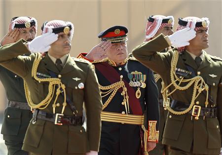 Jordan's King Abdullah (C) reviews an honour guard prior to the opening of the first session for the new parliament in Amman, February 10, 2013. REUTERS/Ali Jarekji
