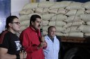 Venezuela's Vice President Maduro speaks during a visit to Fama de America's coffee processing plant in Caracas
