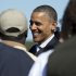 President Barack Obama greets people on the tarmac as he arrives at Newport News Williamsburg International Airport on Air Force One, Saturday, Oct. 13, 2012, in Williamsburg, Va. (AP Photo/Carolyn Kaster)