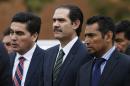 The ex-Gov. of Sonora state Guillermo Padres, center, walks to turn himself in to authorities in Mexico City, Thursday, Nov. 10, 2016. Padres sought by authorities on suspicion of corruption was detained and escorted by marines to a jail in the capital. (AP Photo/Marco Ugarte)