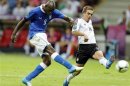 Italy's Balotelli scores during their Euro 2012 semi-final soccer match against Germany at the National stadium in Warsaw,