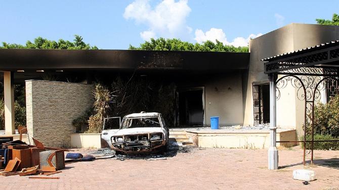A burnt house and a car are seen inside the US Embassy compound on September 12, 2012 in Benghazi, Libya, following an overnight attack on the building