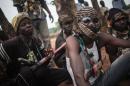 Anti-Balaka militia members rest in the outskirts of Bambari, on July 31, 2014