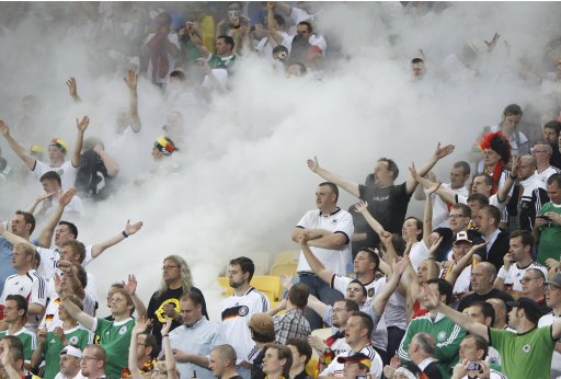 Germany soccer fans celebrate a goal against Portugal during their Group B Euro 2012 soccer match in Lviv