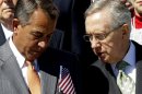 House Speaker John Boehner of Ohio, left, talks with Senate Majority Leader Harry Reid of Nev., on Capitol Hill in Washington, Tuesday, Sept. 11, 2012, during a Congressional remembrance ceremony for the events of 9/11. (AP Photo/Alex Brandon)