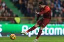 Portugal's Cristiano Ronaldo shoots to score the opening goal during their friendly soccer match with Cameroon Wednesday, March 5 2014, in Leiria, Portugal. The game is part of both teams' preparation for the World Cup in Brazil. (AP Photo/Armando Franca)
