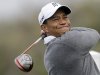 Tiger Woods follows the flight of his drive on the second hole of the South Course at Torrey Pines during the third round of the Farmers Insurance Open golf tournament on Sunday, Jan. 27, 2013, in San Diego. (AP Photo/Lenny Ignelzi)