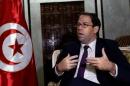 Tunisia's Prime Minister Youssef Chahed talks during an interview with Reuters in Tunis