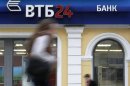 People pass by an office of VTB bank in central Moscow