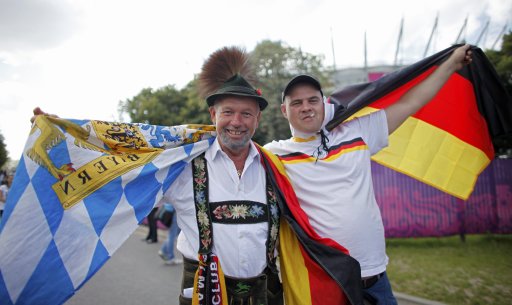 Germany fans pose for a photo as they make their way to the National stadium in Warsaw
