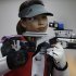 China's Yi Siling shoots during qualifiers for the women's 10-meter air rifle event, at the 2012 Summer Olympics, Saturday, July 28, 2012, in London. (AP Photo/Rebecca Blackwell)