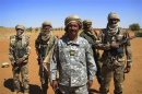 Malian Colonel Gamou poses for a picture with soldiers under his command in Gao