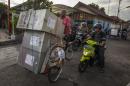Ballot boxes are delived by Becak transport, traditional Indonesian public commuter ride, to voting centers in Yogyakarta in central Java island on July 8, 2014