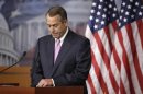 Boehner pauses during remarks to reporters in a news conference on Capitol Hill in Washington