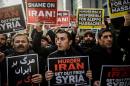Protesters shout anti-Iran slogans in front of the Iranian embassy in Istanbul, during a demonstration against Iranian involvement in the siege of Aleppo