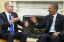 President Barack Obama, right, talks with Ukraine Prime Minister Arseniy Yatsenyuk, left, in the Oval Office of the White House in Washington, Wednesday, March 12, 2014. Obama welcomed Ukraine's new prime minister as the U.S. seeks to highlight ties with the former Soviet republic now caught in a diplomatic battle between East and West.(AP Photo/Pablo Martinez Monsivais)