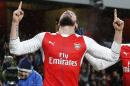Arsenal's Olivier Giroud celebrates after scoring during the English Premier League soccer match between Arsenal and Crystal Palace at the Emirates stadium in London, Sunday, Jan. 1, 2017.(AP Photo/Frank Augstein)