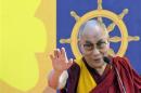 The Dalai Lama addresses a gathering at a stadium in the northeastern Indian city of Guwahati