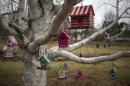 Mementos for 20 students and six educators, killed in the massacre at Sandy Hook Elementary School, hang from a tree in Newtown, Connecticut