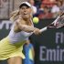 Wozniacki returns a shot against Kerber at the BNP Paribas Open WTA tennis tournament in California