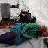 Angie Taggart rests in a musher tent at the Finger Lake checkpoint in Alaska during the Iditarod Trail Sled Dog Race on Monday, March 4, 2013. (AP Photo/The Anchorage Daily News, Bill Roth)