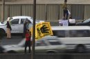Members of the Muslim Brotherhood and supporters of ousted Egyptian President Mursi protest against the military and interior ministry at a highway south Cairo