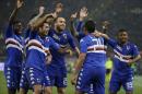 Sampdoria's Luis Muriel, second right, celebrates with his teammates after scoring during a Serie A soccer match between Roma and Sampdoria, at Rome's Olympic Stadium, Monday, March 16, 2015. (AP Photo/Andrew Medichini)